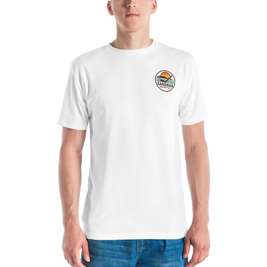 White hockey t-shirt shown from the front with a small circular Sandbar Hockey Co. chest logo in full color, featuring a sunset over water and a hockey stick.