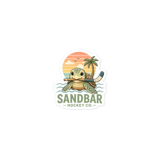 Small Sea turtle hockey sticker featuring a cute turtle holding a hockey stick in front of a retro beach sunset, ocean waves, palm tree, and Sandbar Hockey Co. lettering.