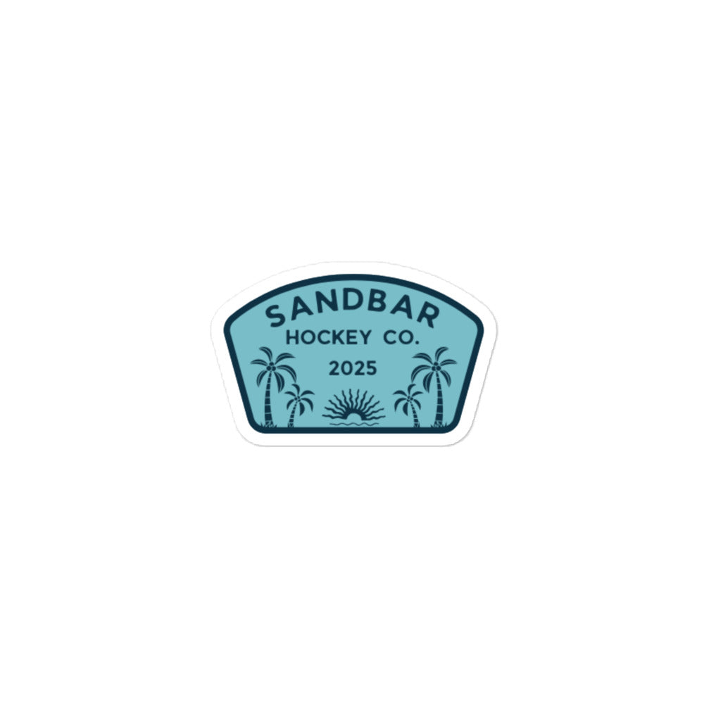 Medium Sandbar Hockey Co. 2025 sticker with a teal badge design, palm trees, sunrise, and bold logo text.