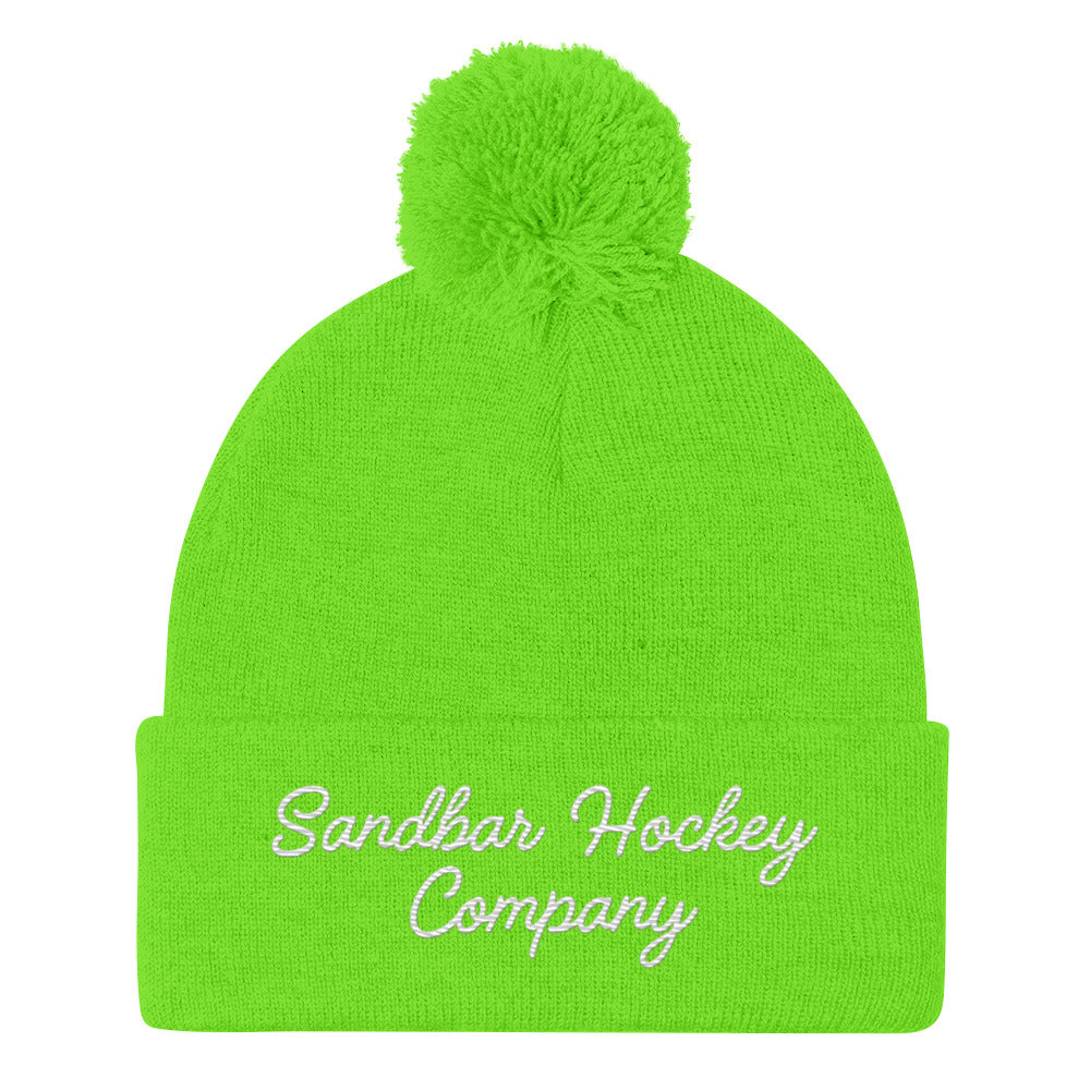 Neon green hockey beanie front side with pom pom and Sandbar Hockey Company cursive script logo