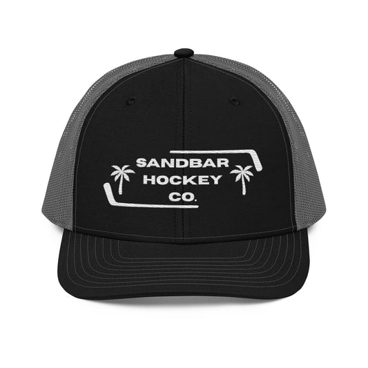 Black and charcoal gray hockey snapback hat front view with white Sandbar Hockey Co. logo.