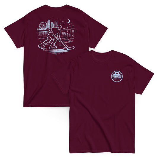 Maroon roller hockey t-shirt showing back graphic with a roller hockey player skating by the water at night and blue front chest Sandbar Hockey Co. logo.