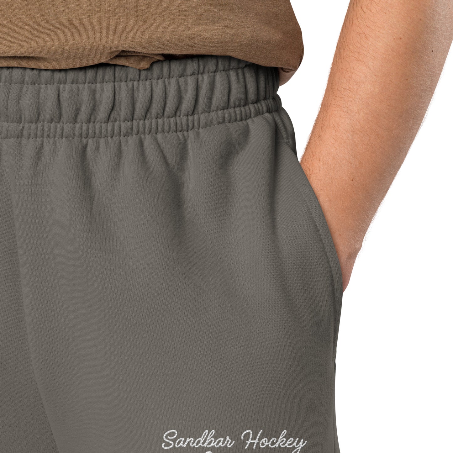 Asphalt hockey sweatpants close-up of left leg with Sandbar Hockey Company cursive logo