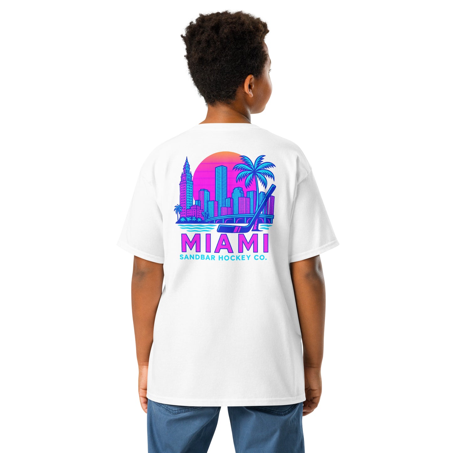 Youth white Miami Sandbar Hockey T-shirt back view worn by model with large neon Miami skyline graphic and Miami Sandbar Hockey Co. text