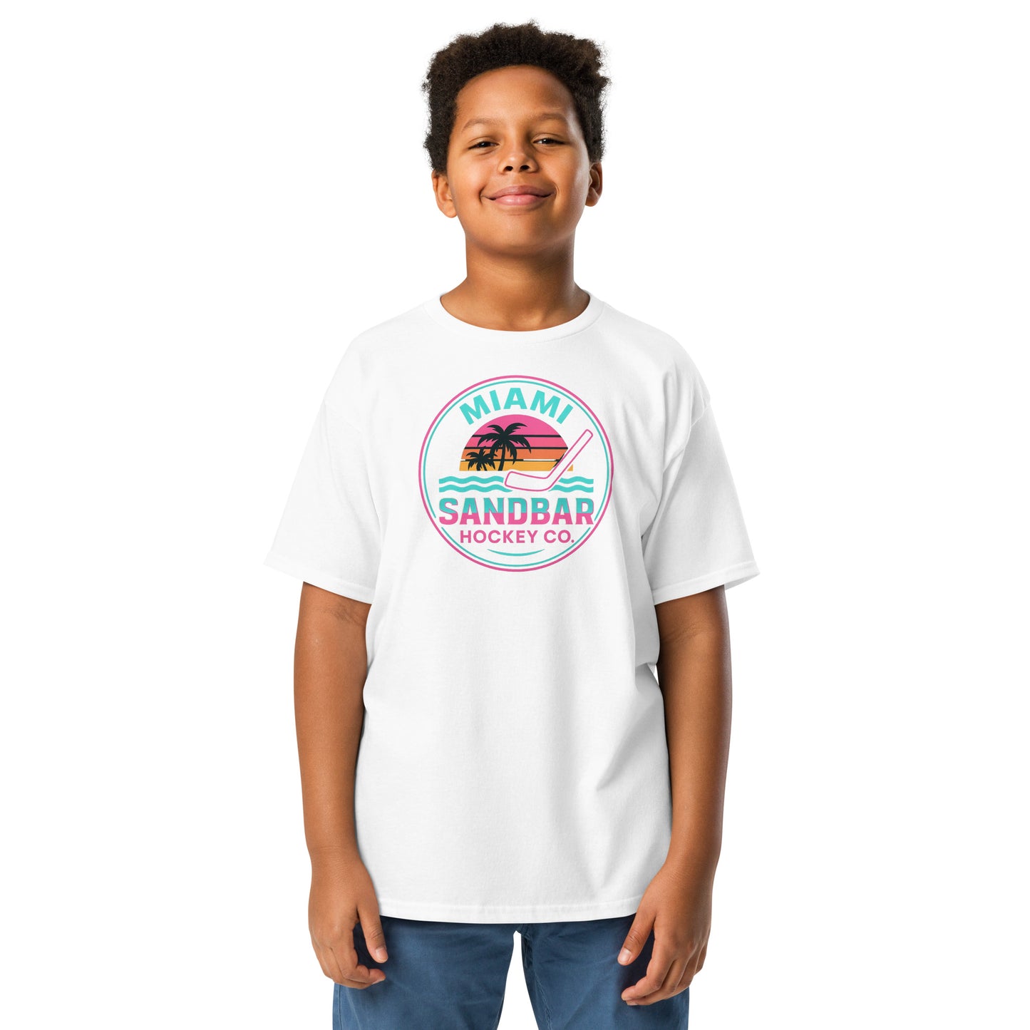 Youth white Miami Sandbar Hockey T-shirt front view with circular Miami Sandbar Hockey Co. graphic featuring palm trees, sunset stripes, ocean waves, and a hockey stick