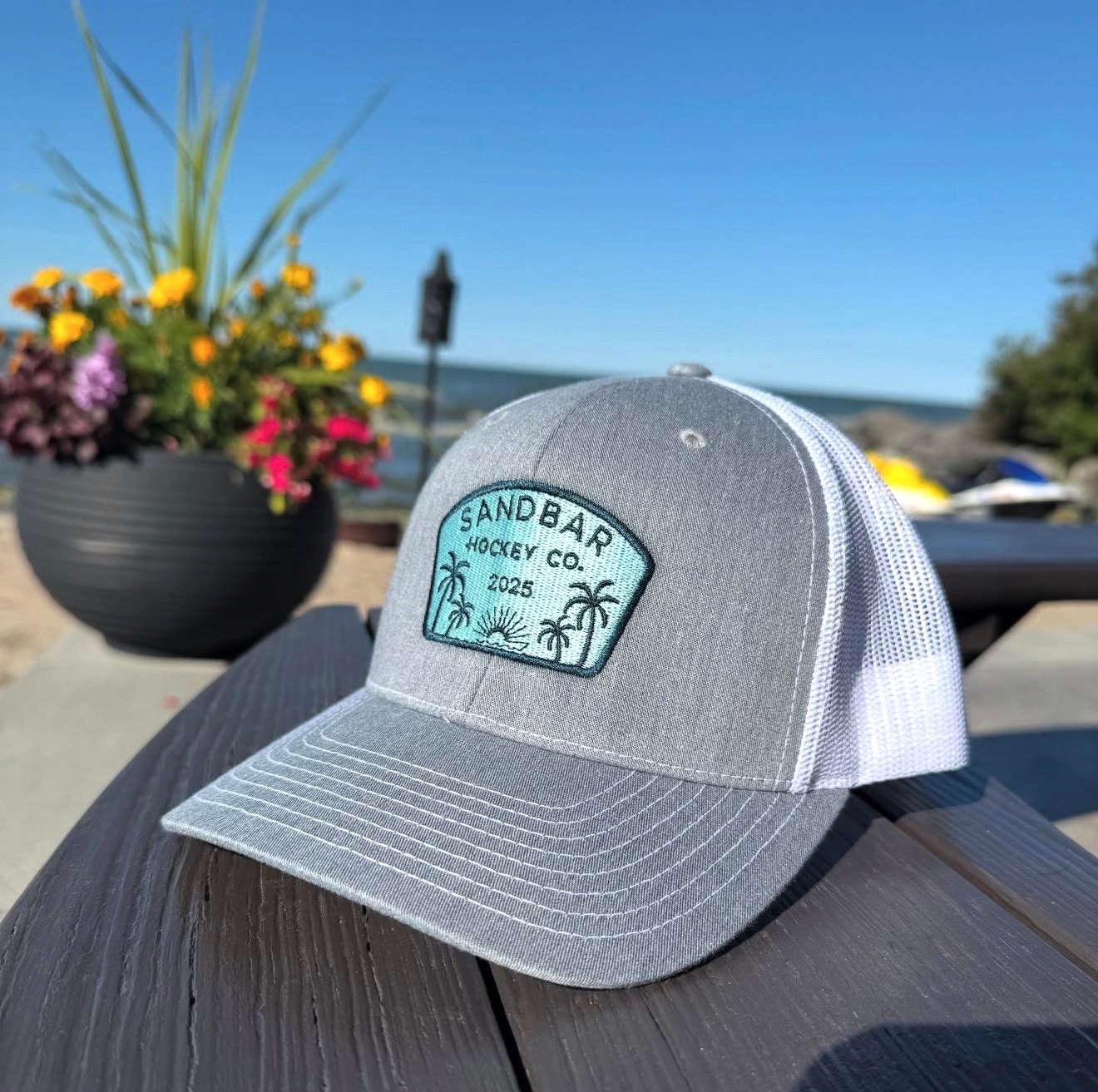 Sandbar Hockey Co. 2025 embroidered snapback hat grey white lifestyle photo