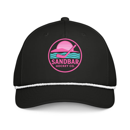 Black women’s hockey rope hat front view with pink Sandbar Hockey Co. sunset logo and white rope detail.
