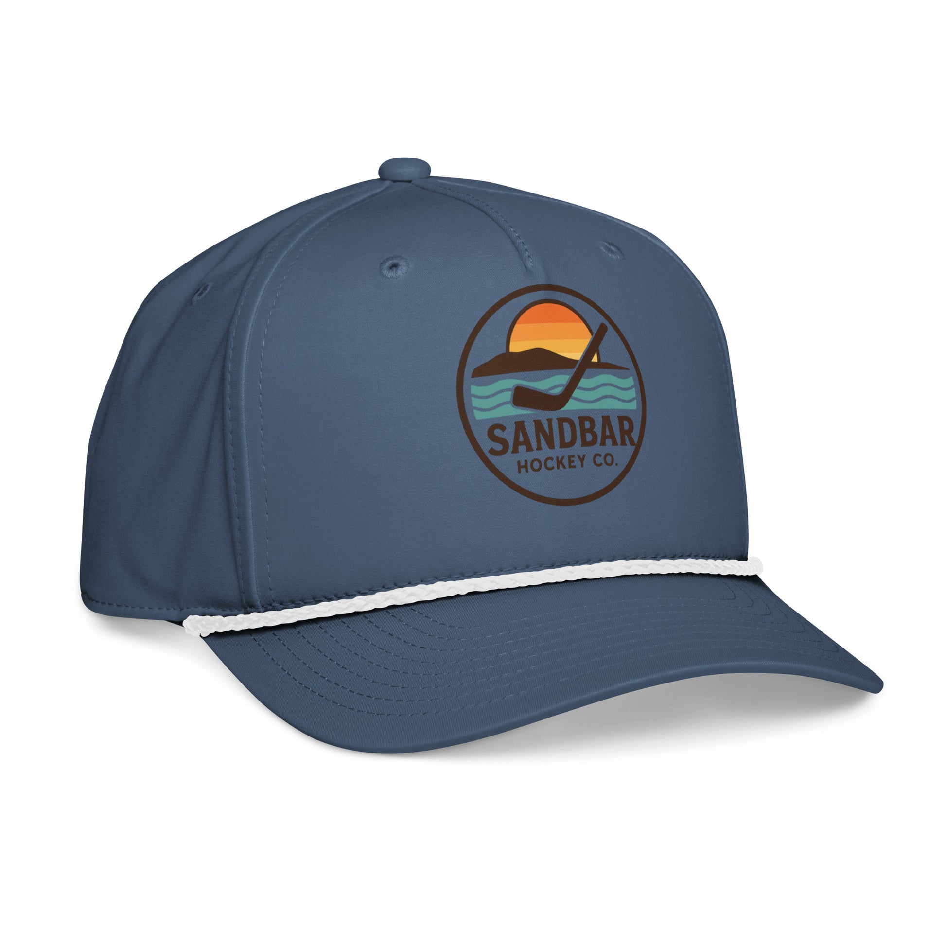 Blue hockey rope hat left front angle view with Sandbar Hockey Co. sunset puck logo and white rope detail.