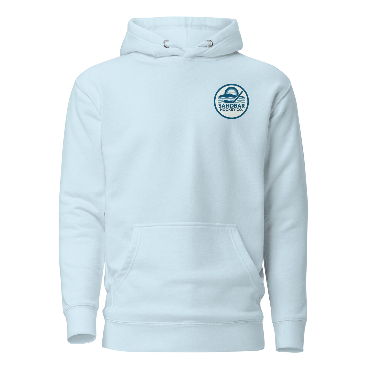 Light blue hockey hoodie front side with small circular Sandbar Hockey Co. chest logo featuring sunset, water, and hockey stick