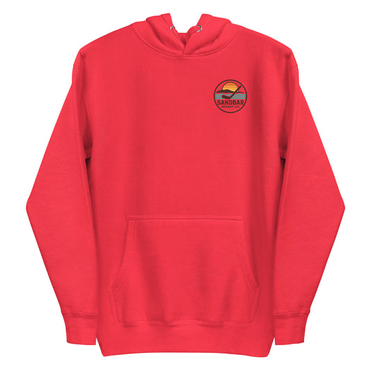Red hockey dog hoodie with a small round Sandbar Hockey Co. sunset logo on the front left chest