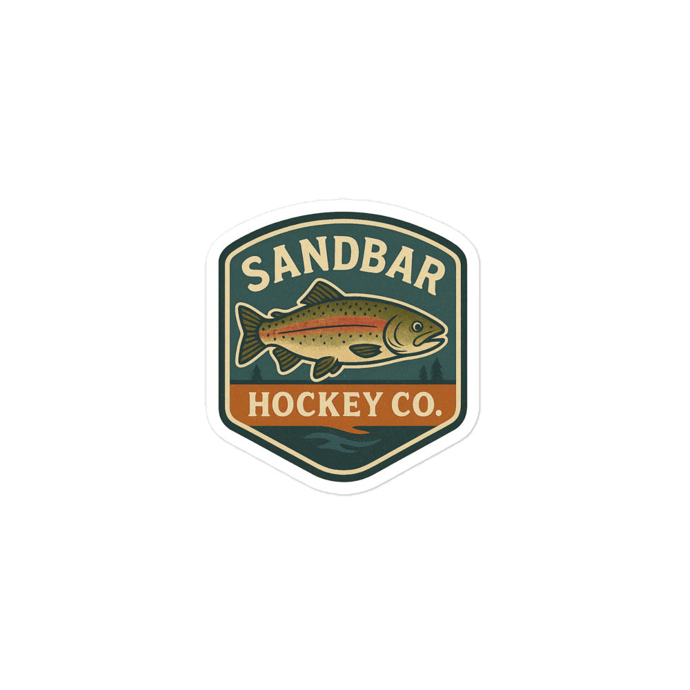Small Sandbar Hockey Co. sticker with a badge-style design featuring a fish, outdoor background, and the words Sandbar Hockey Co.