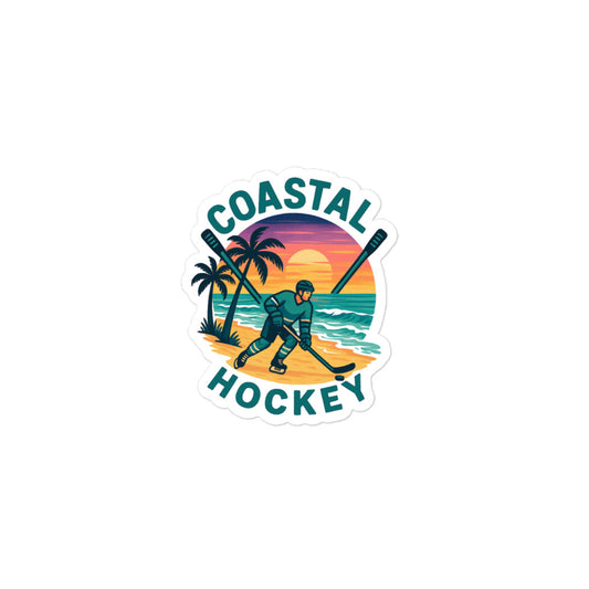 Small Coastal Hockey sticker with a hockey player on a beach, palm trees, ocean waves, crossed sticks, and a colorful sunset background.