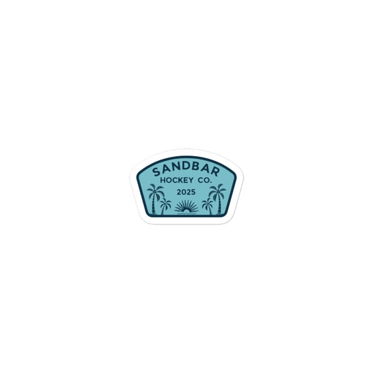 Small Sandbar Hockey Co. 2025 sticker with a teal badge design, palm trees, sunrise, and bold logo text.