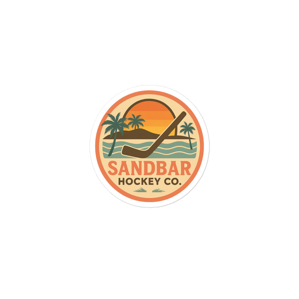 Small Sandbar Hockey Co. sticker with a circular sunset beach design, palm trees, ocean waves, and a large hockey stick.