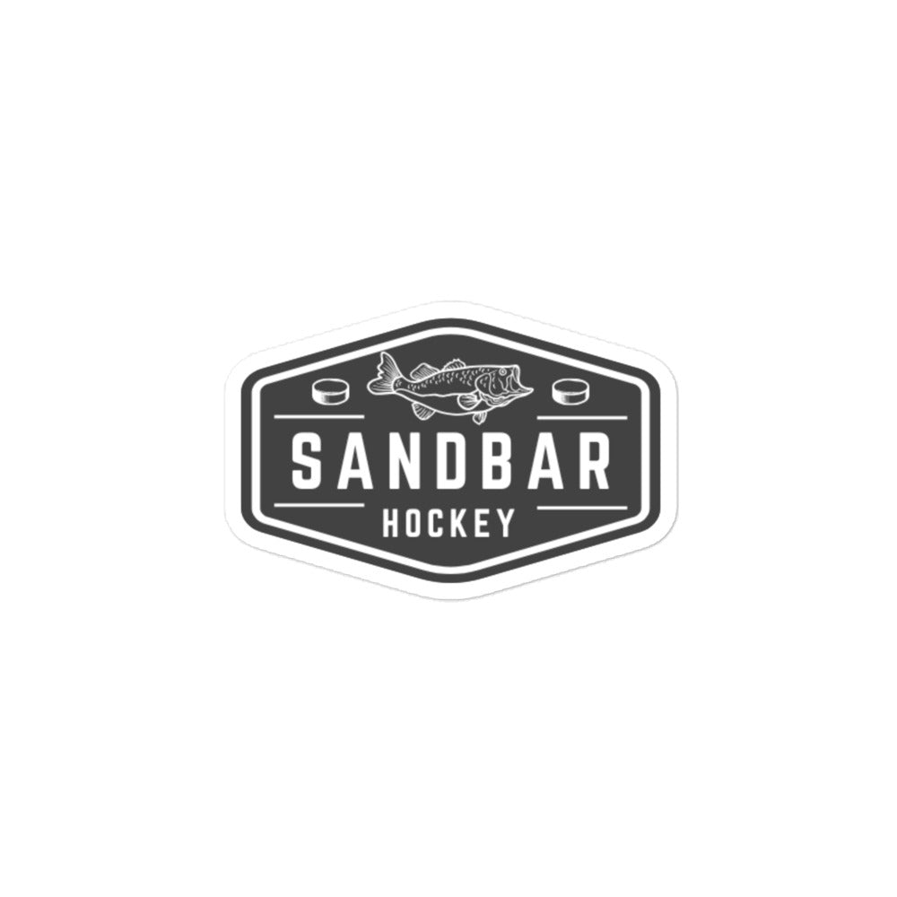 Medium Sandbar Hockey sticker with a black-and-white badge logo featuring a fish above the words Sandbar Hockey and hockey pucks on each side.