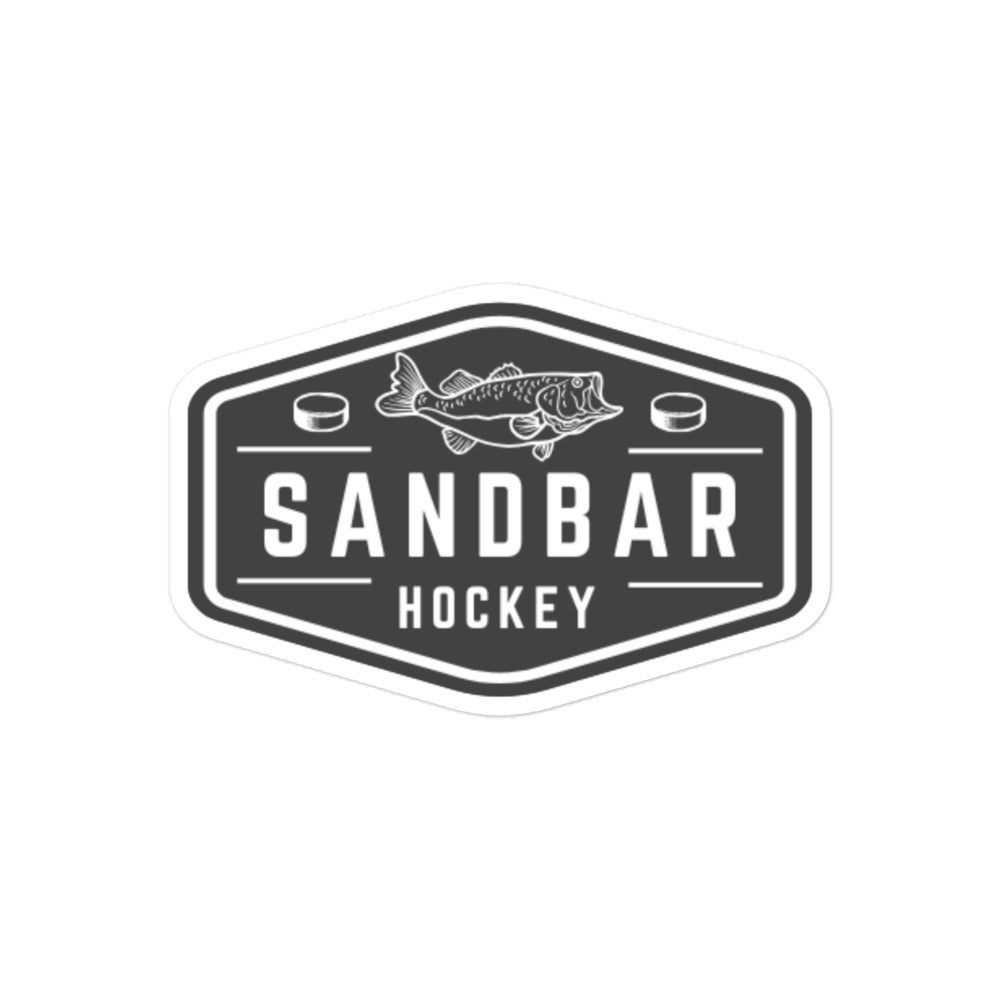 Large Sandbar Hockey sticker with a black-and-white badge logo featuring a fish above the words Sandbar Hockey and hockey pucks on each side.