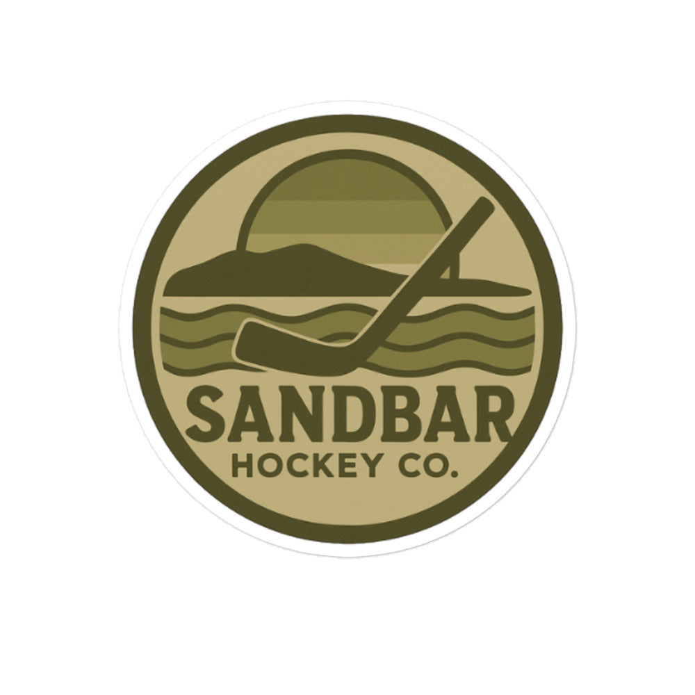 Large Sandbar Hockey Co. camo circular logo sticker featuring a coastal hockey scene with a sunset, shoreline, waves, and hockey stick.