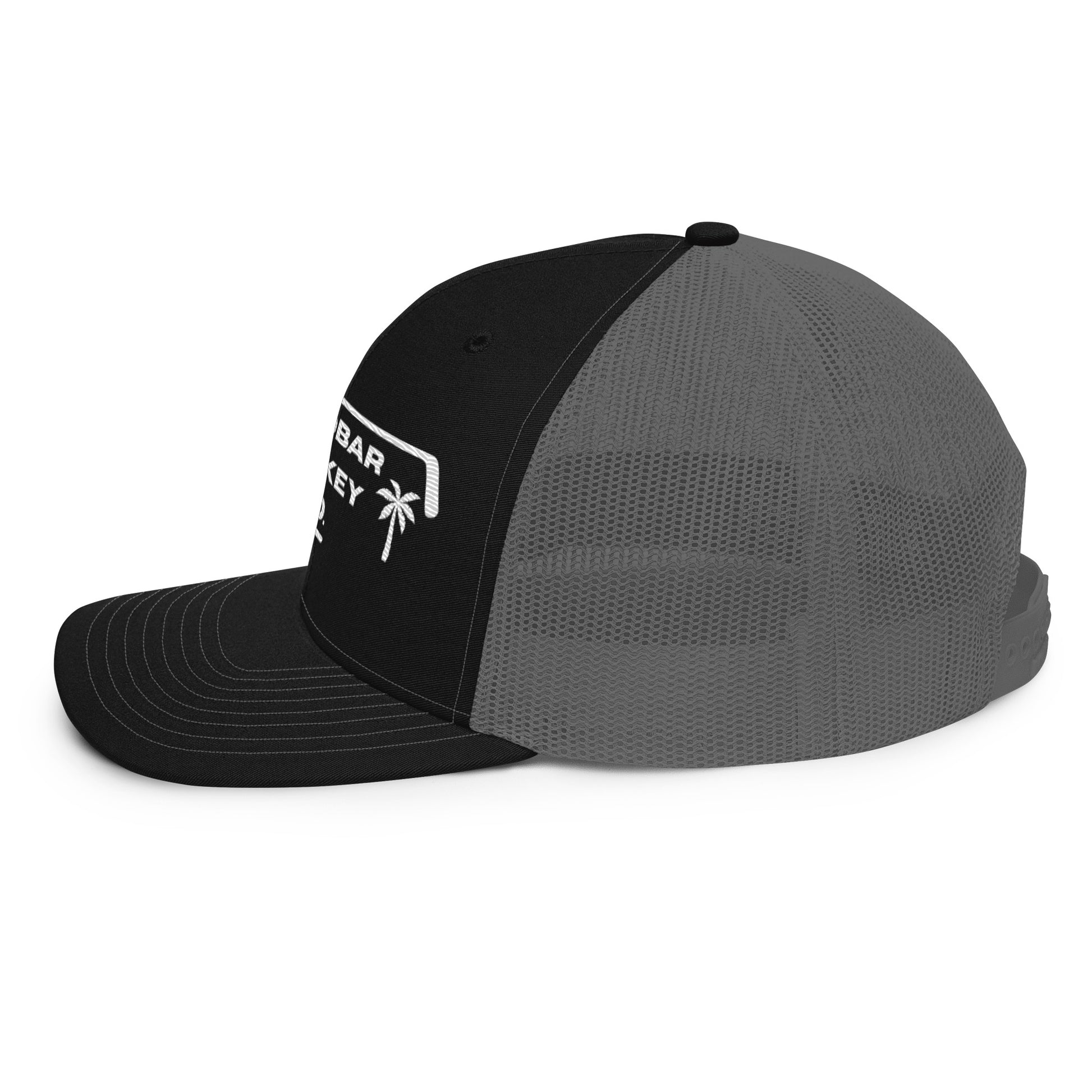 Black and charcoal gray hockey snapback hat left side profile with gray mesh back and curved brim.