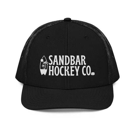 Black hockey snapback hat front view with white Sandbar Hockey Co. logo and surfboard palm tree graphic.