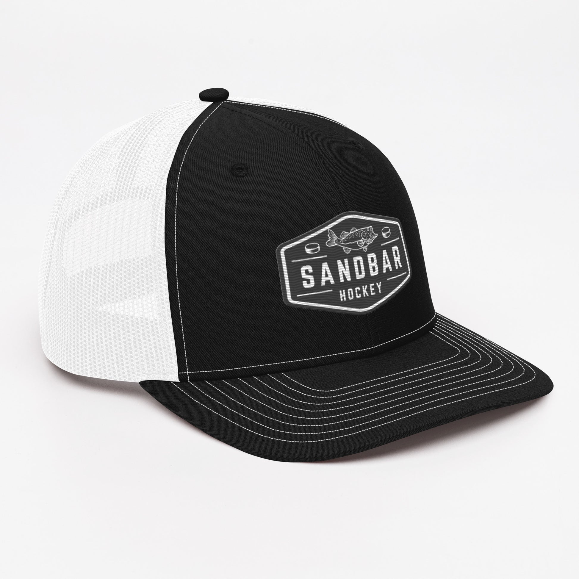 Black and white Sandbar Hockey snapback hat angled front view with black rectangular badge logo featuring a fish