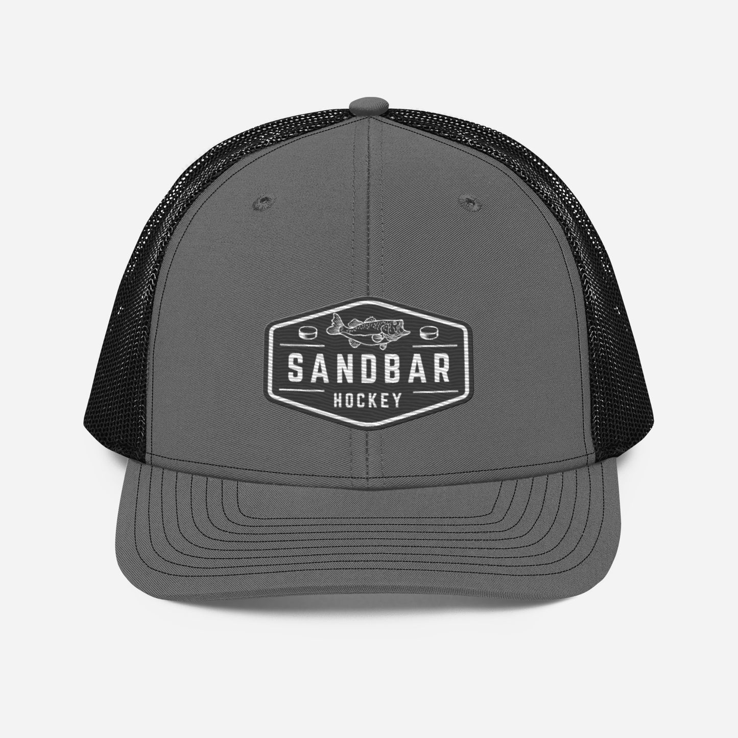 Dark grey and black Sandbar Hockey snapback hat front view with black mesh back and rectangular badge logo featuring a fish
