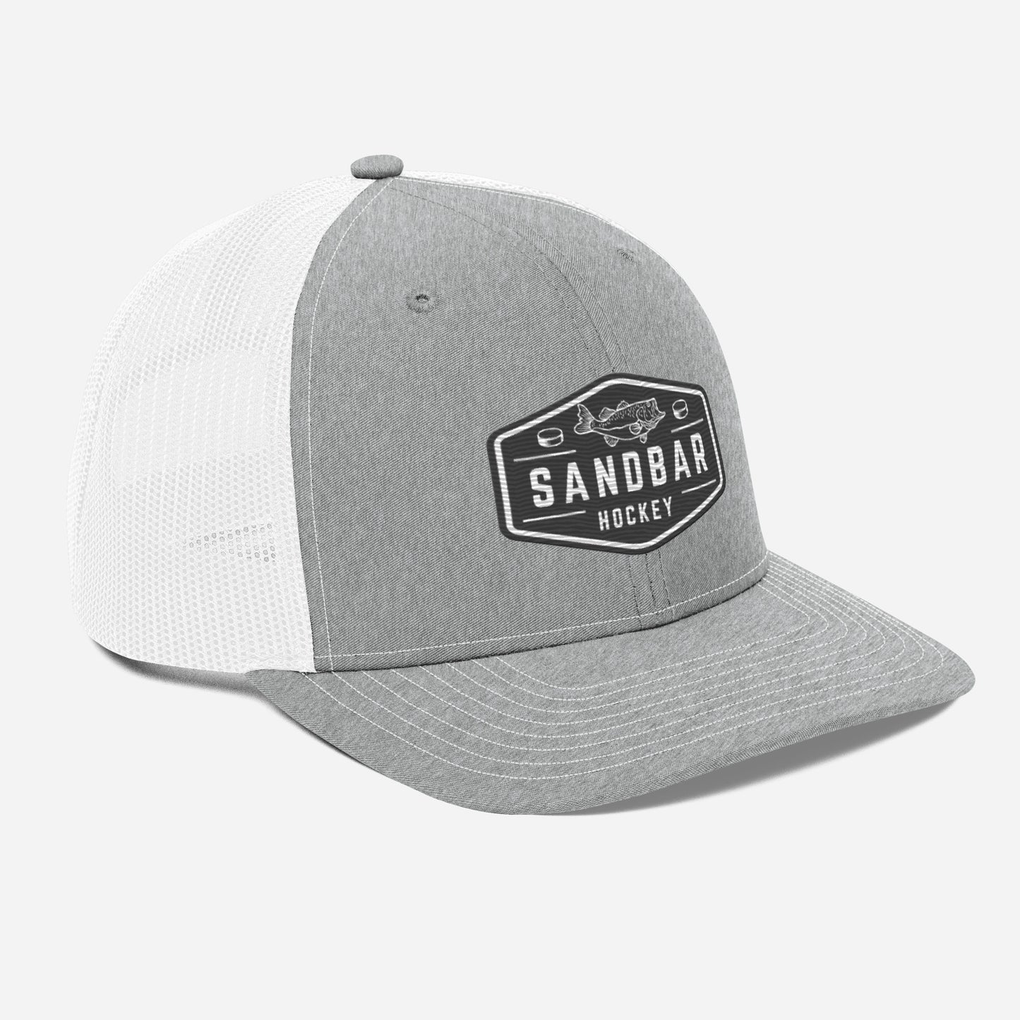 Light grey and white Sandbar Hockey snapback hat angled front view with rectangular badge logo featuring a fish