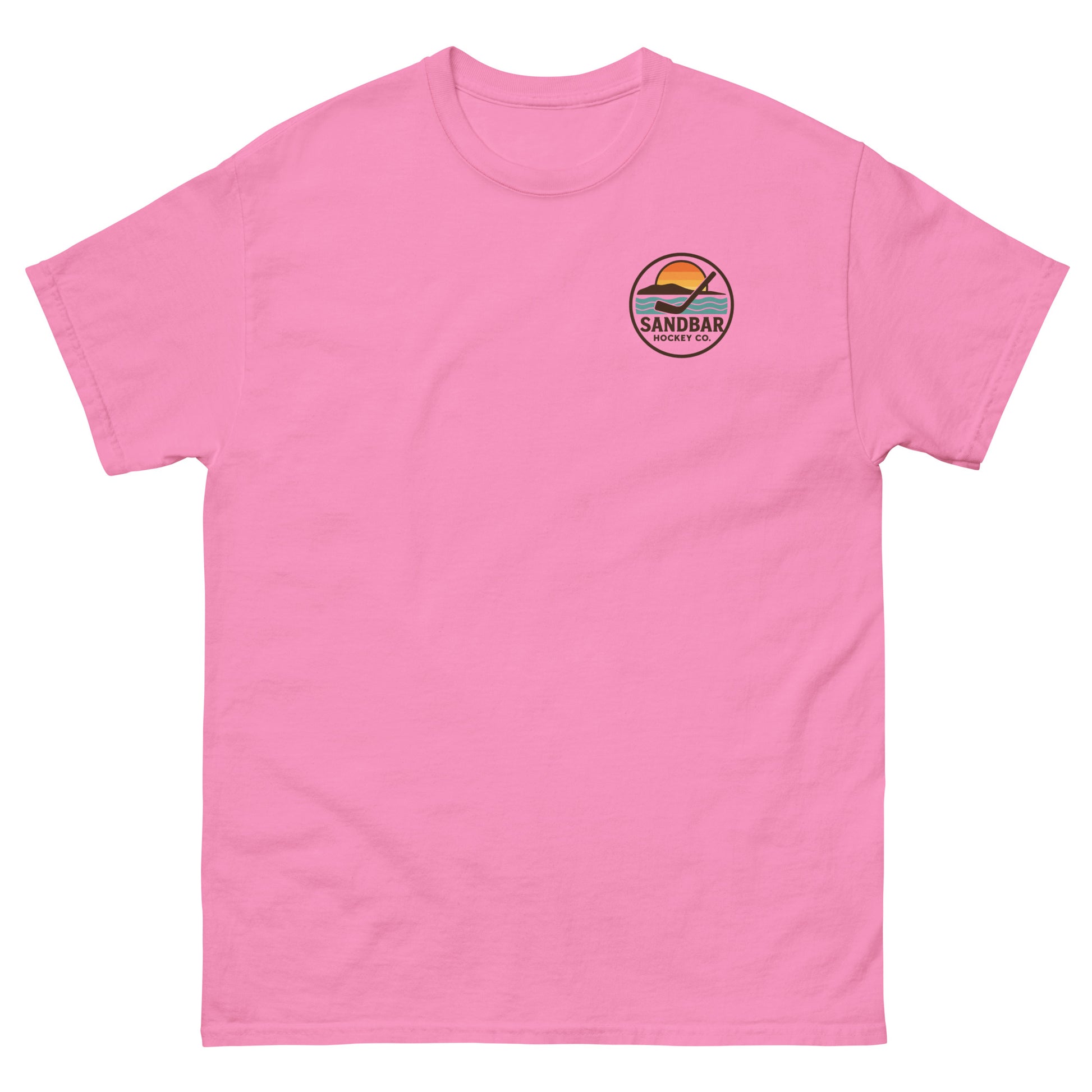 Pink hockey t-shirt with small front chest logo featuring a circular Sandbar Hockey Co. sunset-and-stick emblem.