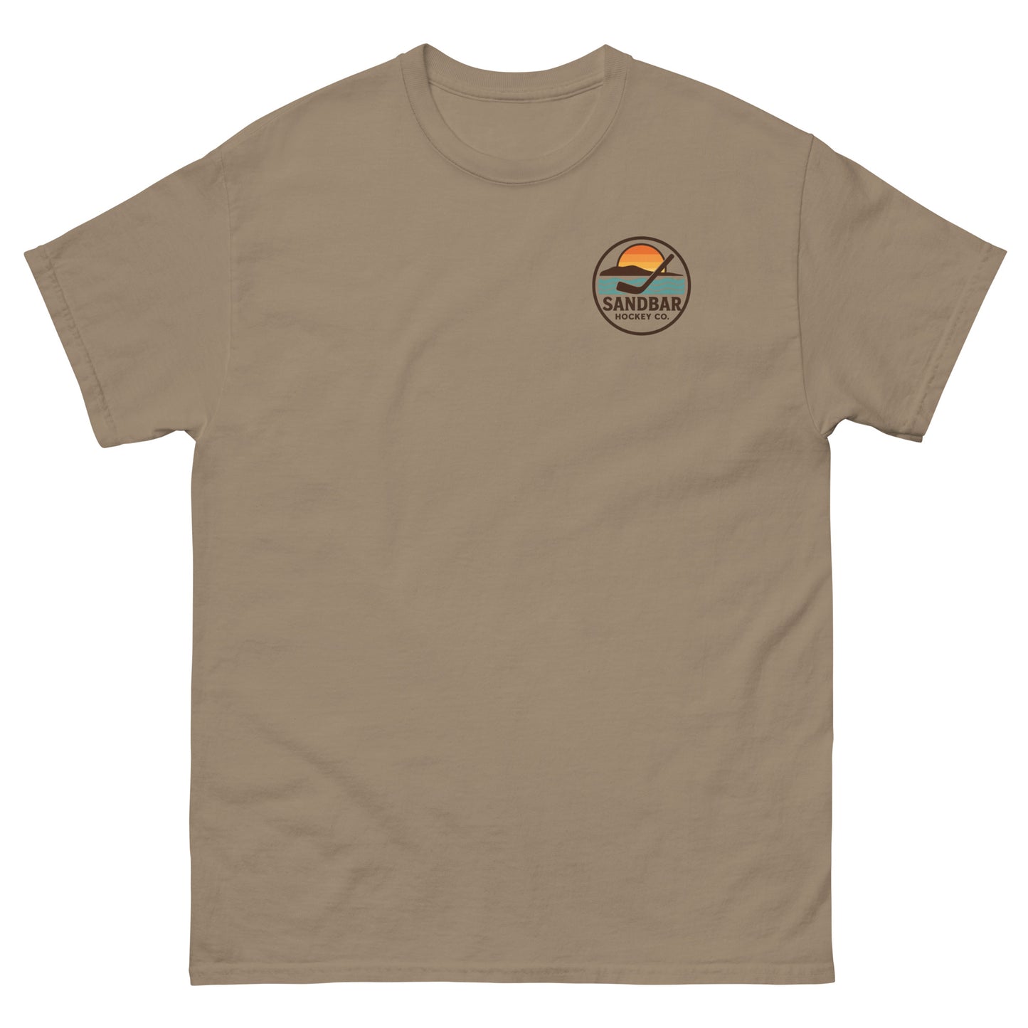 Brown T-shirt with a small left chest logo showing a sunset, ocean waves, and a hockey stick with the text “Sandbar Hockey Co.”