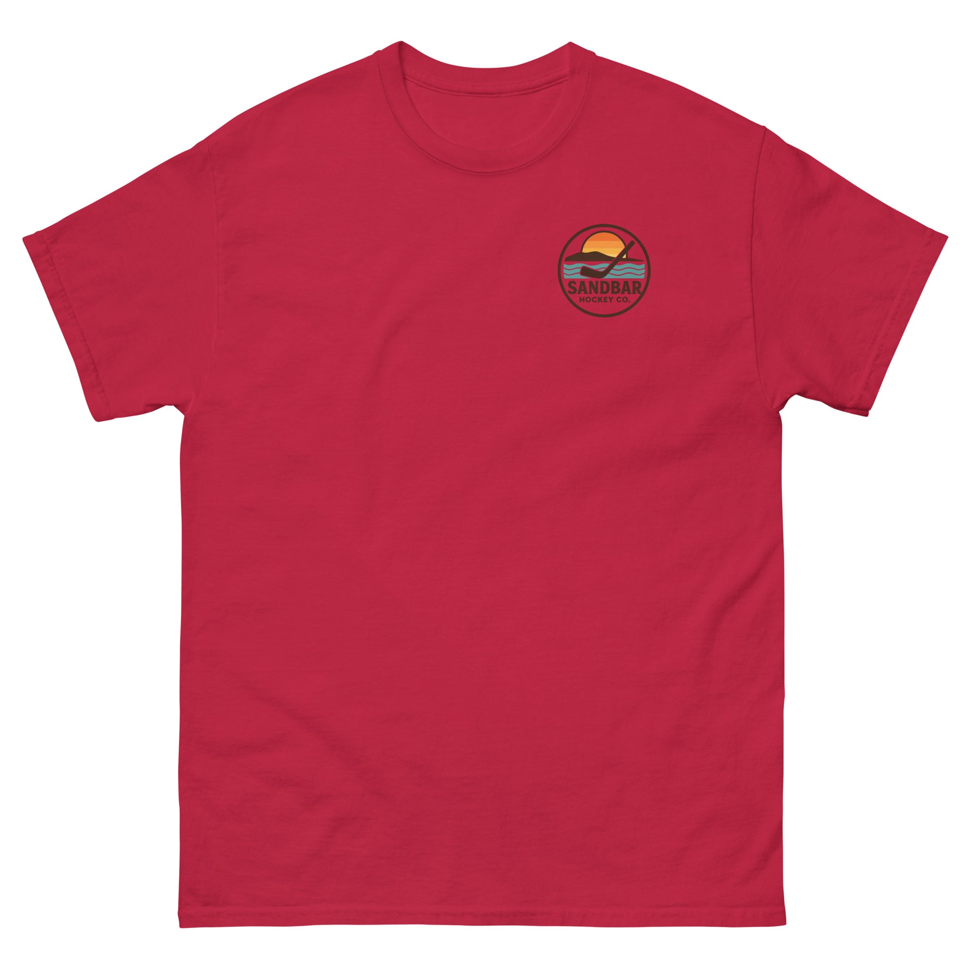 Red hockey t-shirt with small front chest logo featuring a circular Sandbar Hockey Co. sunset-and-stick emblem.