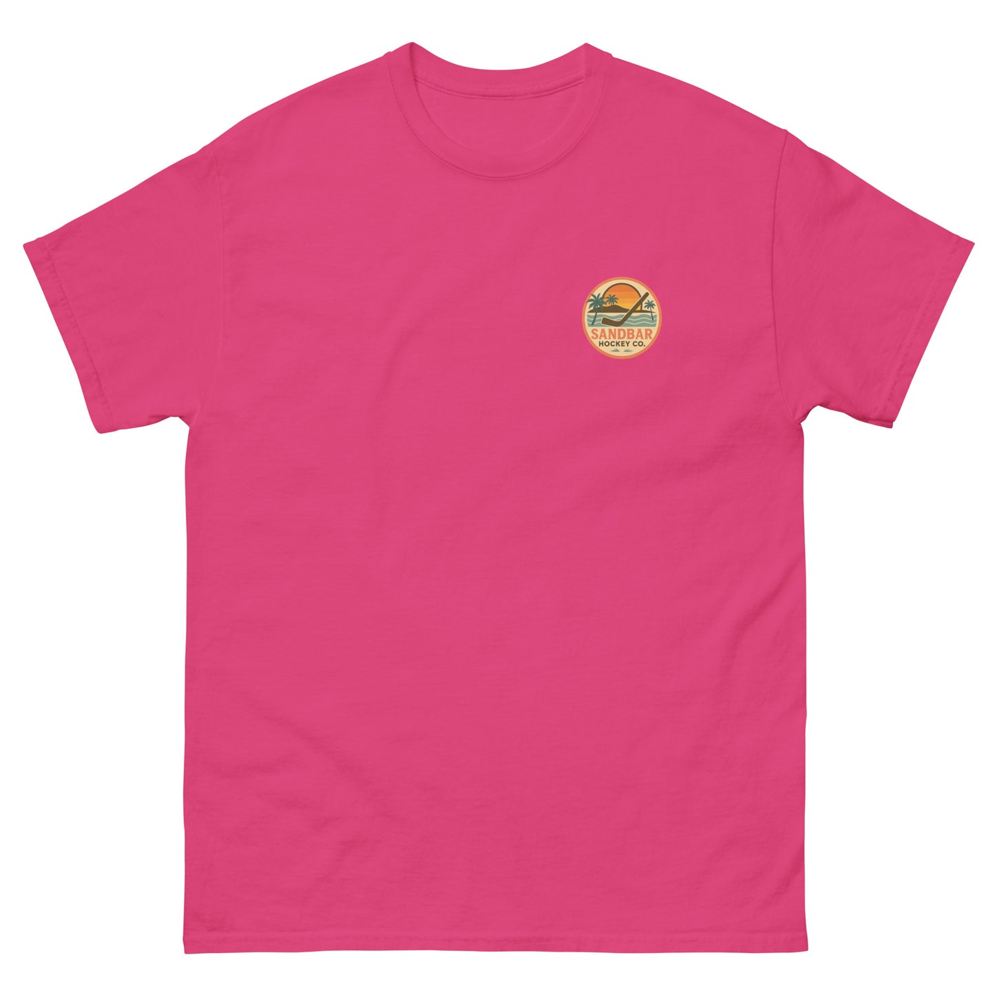 Pink hockey t-shirt front side with small circular Sandbar Hockey Co. sunset, palm tree, ocean wave, and hockey stick chest logo