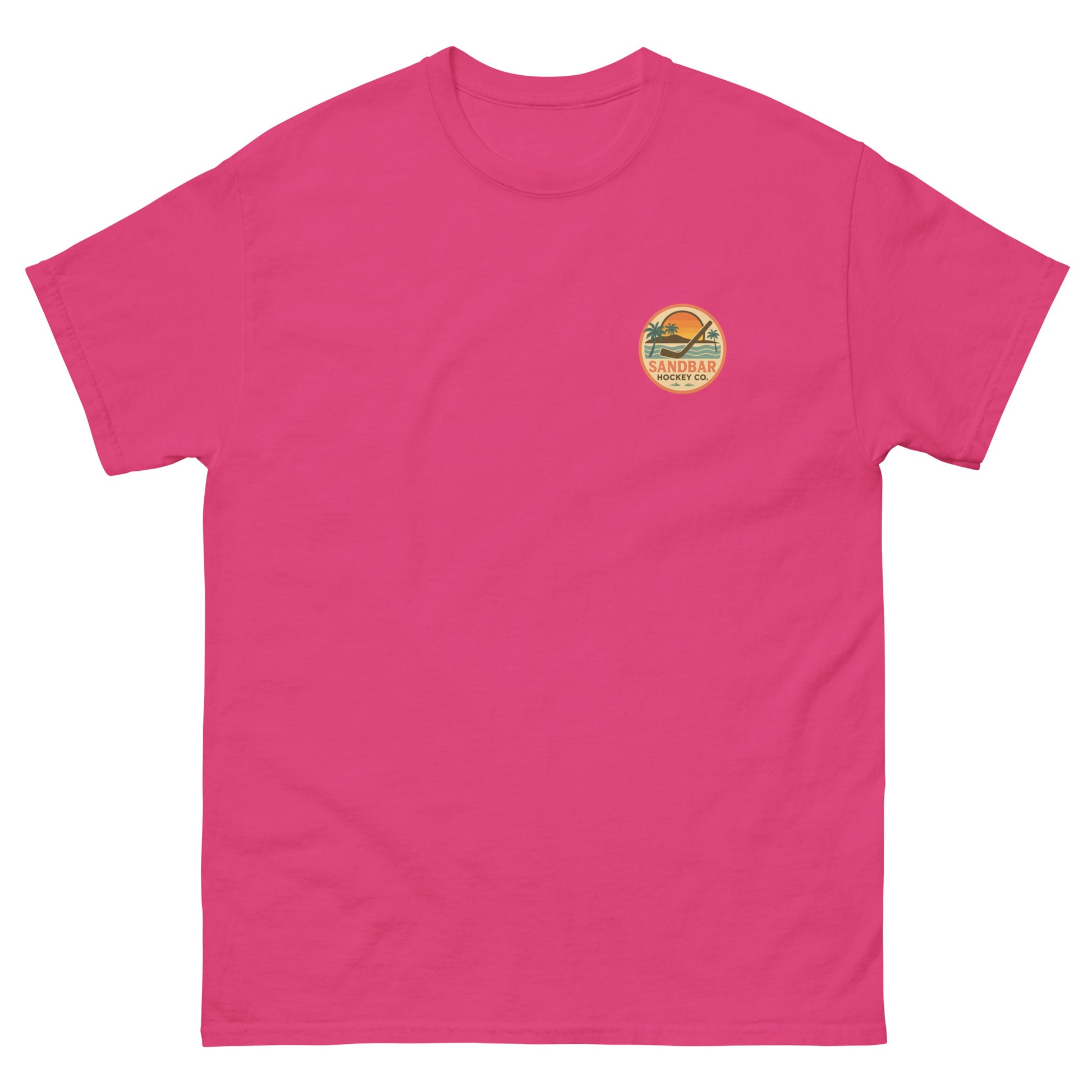 Pink hockey t-shirt front side with small circular Sandbar Hockey Co. sunset, palm tree, ocean wave, and hockey stick chest logo