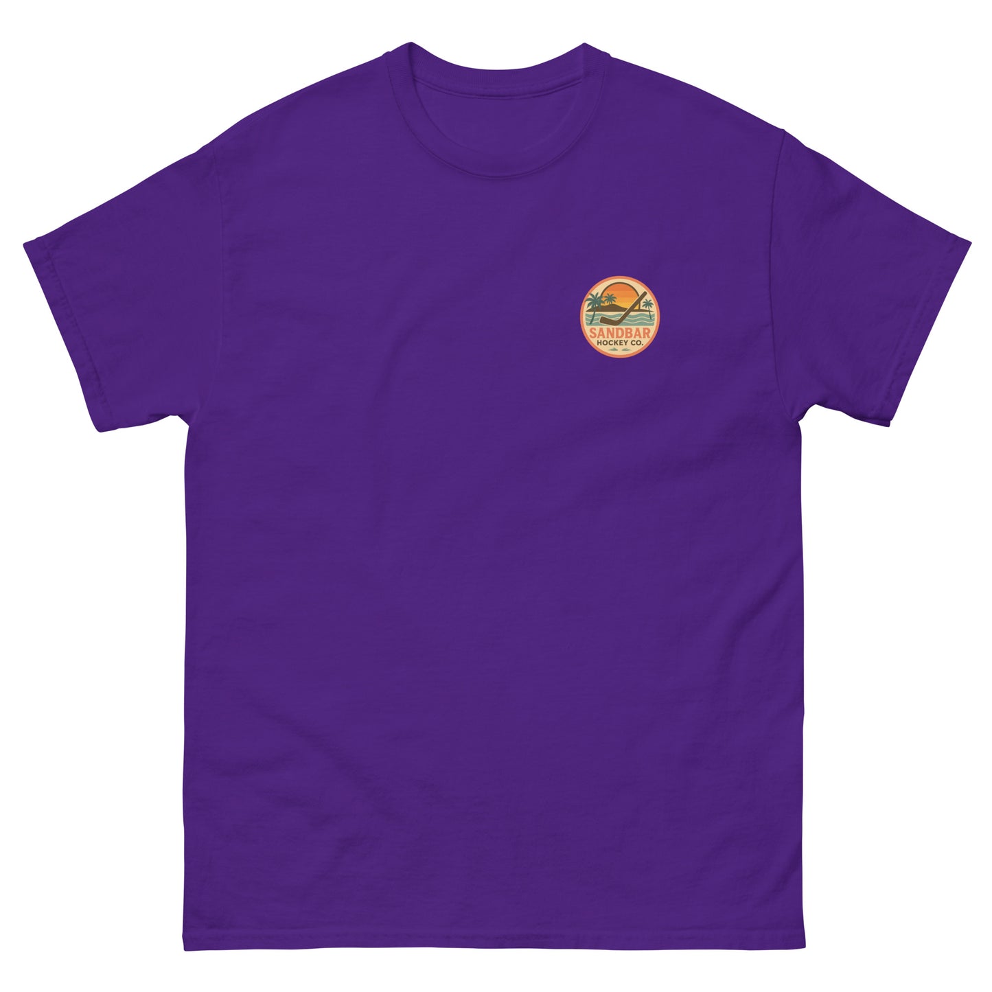 Purple hockey t-shirt front side with small circular Sandbar Hockey Co. sunset, palm tree, ocean wave, and hockey stick chest logo