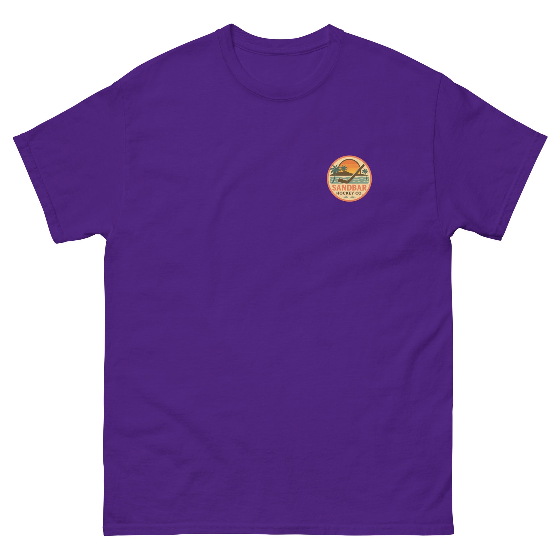 Purple hockey t-shirt front side with small circular Sandbar Hockey Co. sunset, palm tree, ocean wave, and hockey stick chest logo