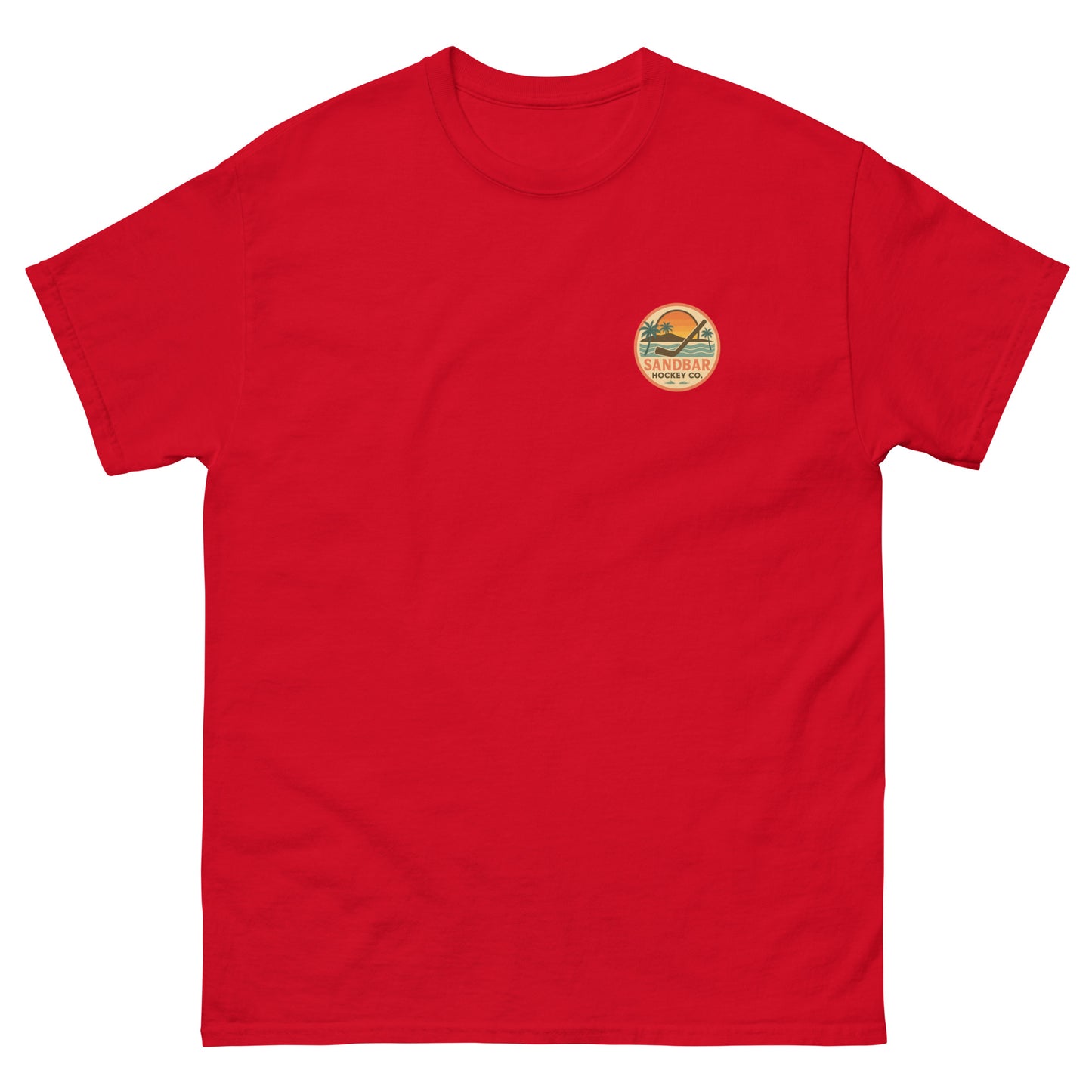 Red hockey t-shirt front side with small circular Sandbar Hockey Co. sunset, palm tree, ocean wave, and hockey stick chest logo