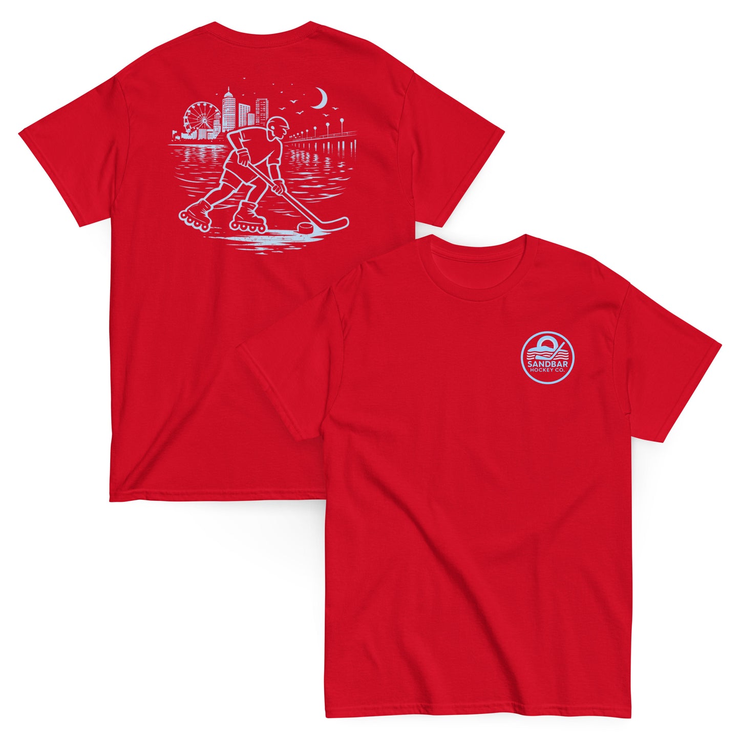 Red roller hockey t-shirt showing back graphic with a roller hockey player skating by the water at night and blue front chest Sandbar Hockey Co. logo.