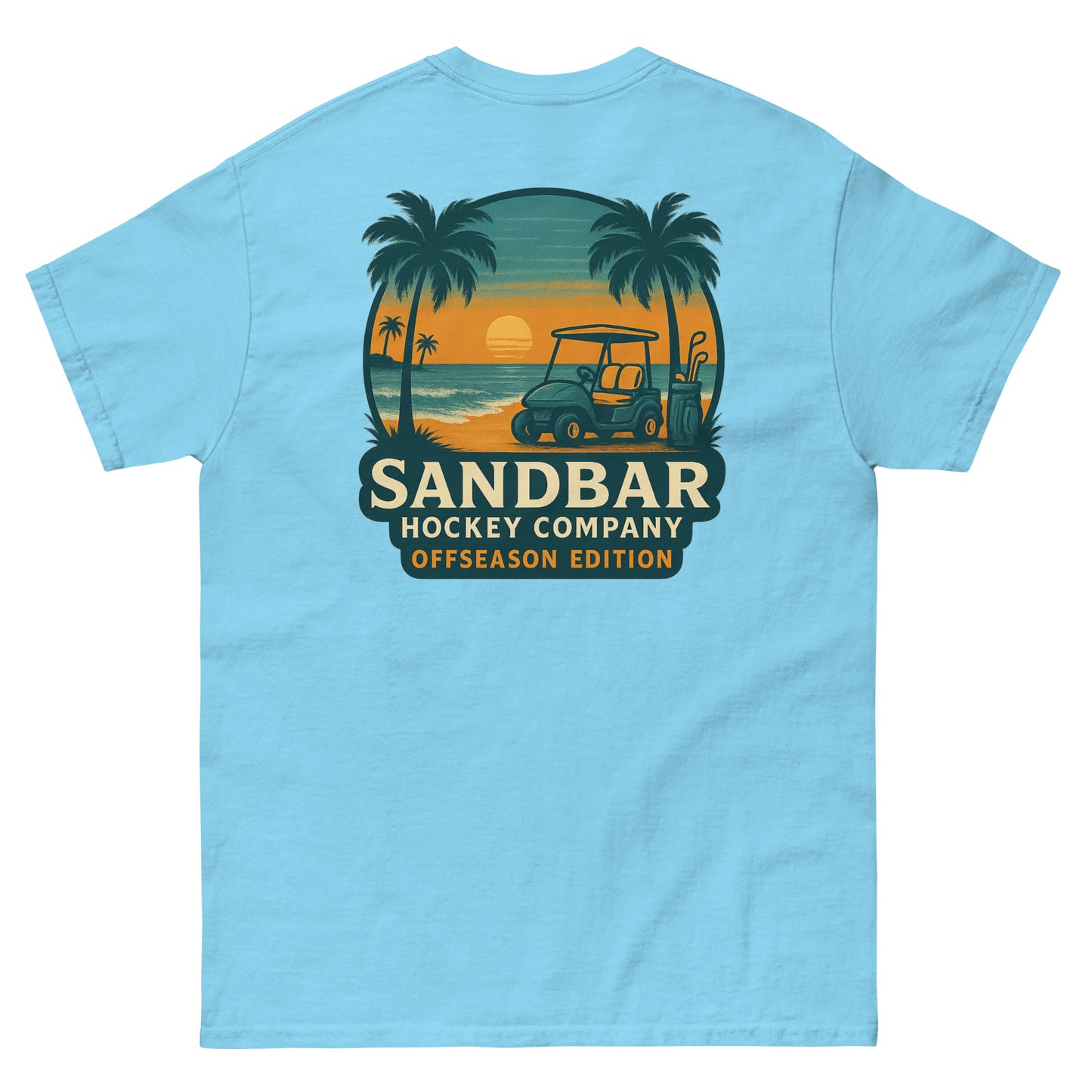 Sky blue T-shirt with a large back graphic of a beach sunset scene featuring palm trees, ocean waves, a golf cart, hockey sticks, and the text “Sandbar Hockey Company Offseason Edition.”