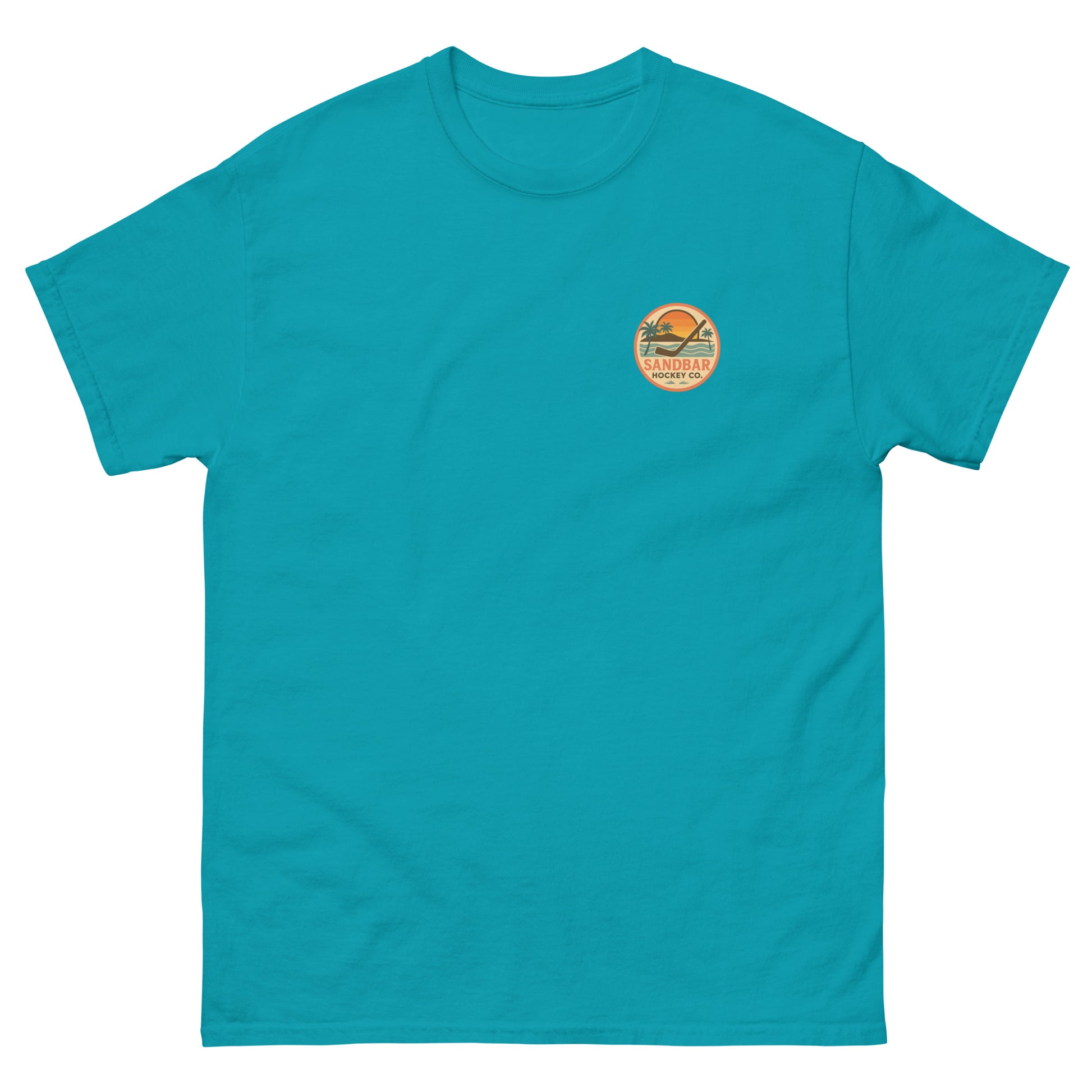 Teal hockey t-shirt front side with small circular Sandbar Hockey Co. sunset, palm tree, ocean wave, and hockey stick chest logo