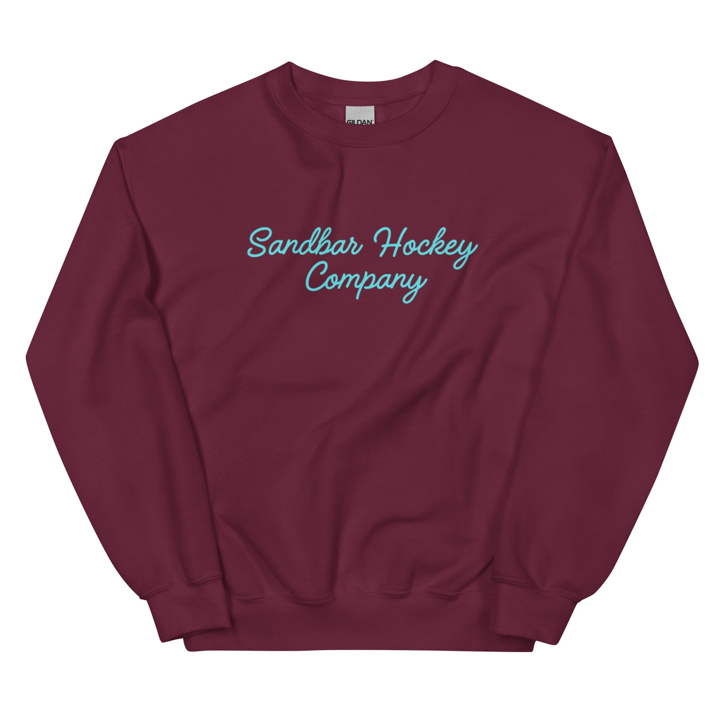 Maroon hockey crewneck sweatshirt front side with turquoise Sandbar Hockey Company cursive logo
