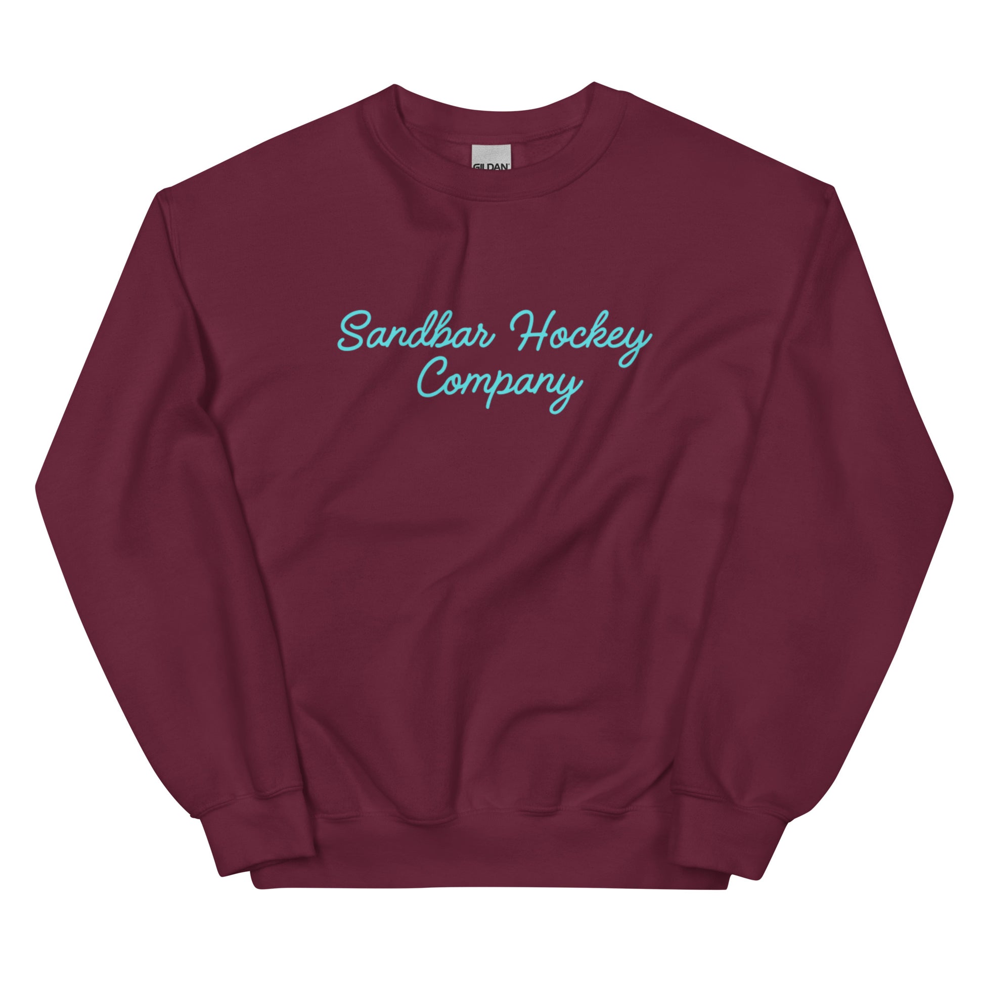 Maroon hockey crewneck sweatshirt front side with turquoise Sandbar Hockey Company cursive logo