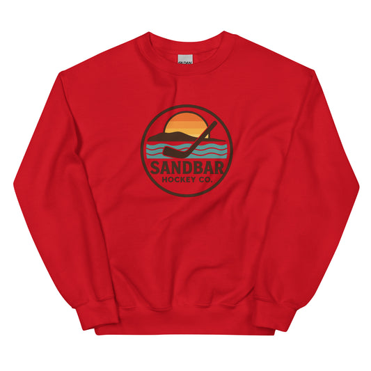 Red hockey crewneck sweatshirt front side with circular Sandbar Hockey Co. sunset wave logo