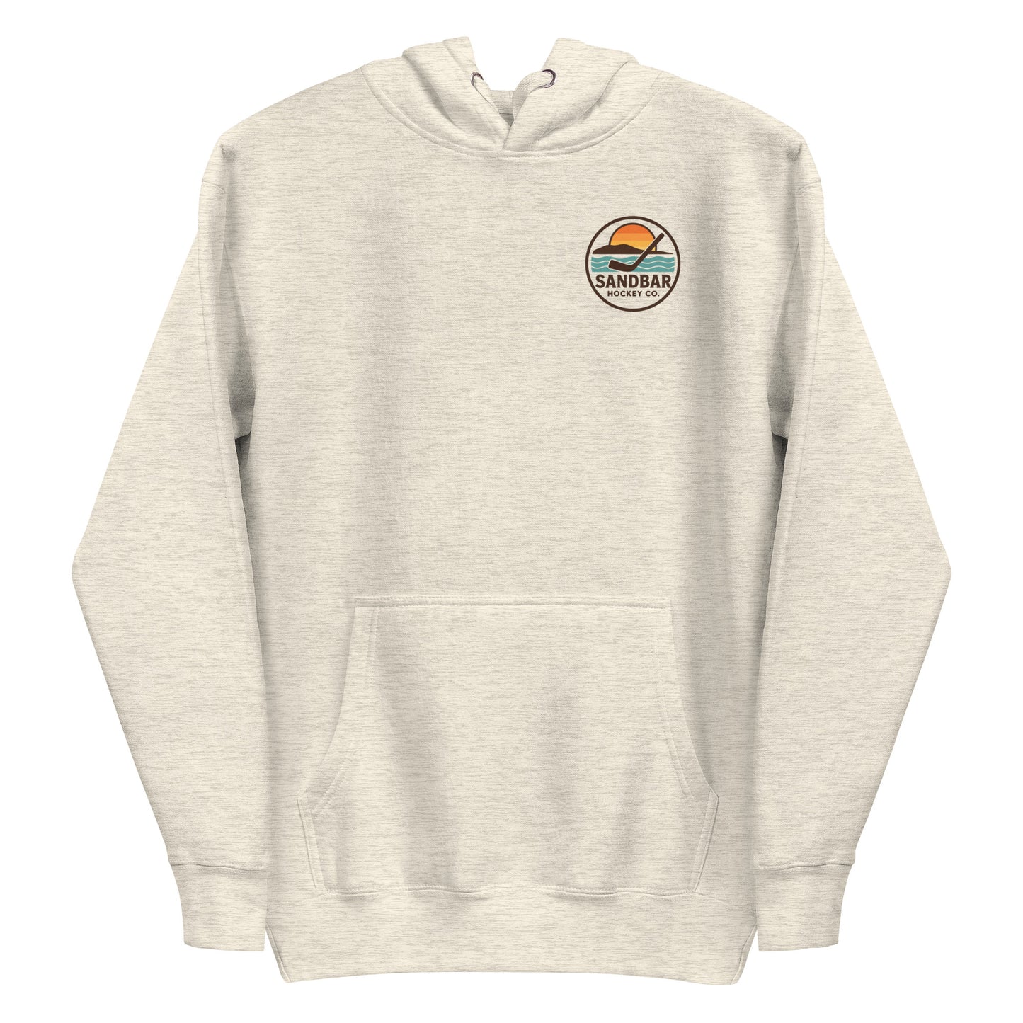 Cream hockey hoodie with a small circular front chest logo showing a sunset over water with a hockey stick and the text “Sandbar Hockey Co.”