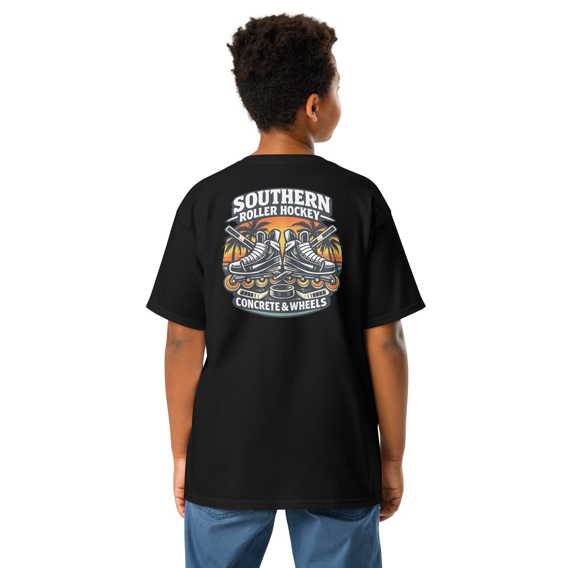 Youth black southern roller hockey t-shirt back view worn by a boy, featuring the Southern Roller Hockey Concrete & Wheels graphic with inline skates, palm trees, sticks, and puck.
