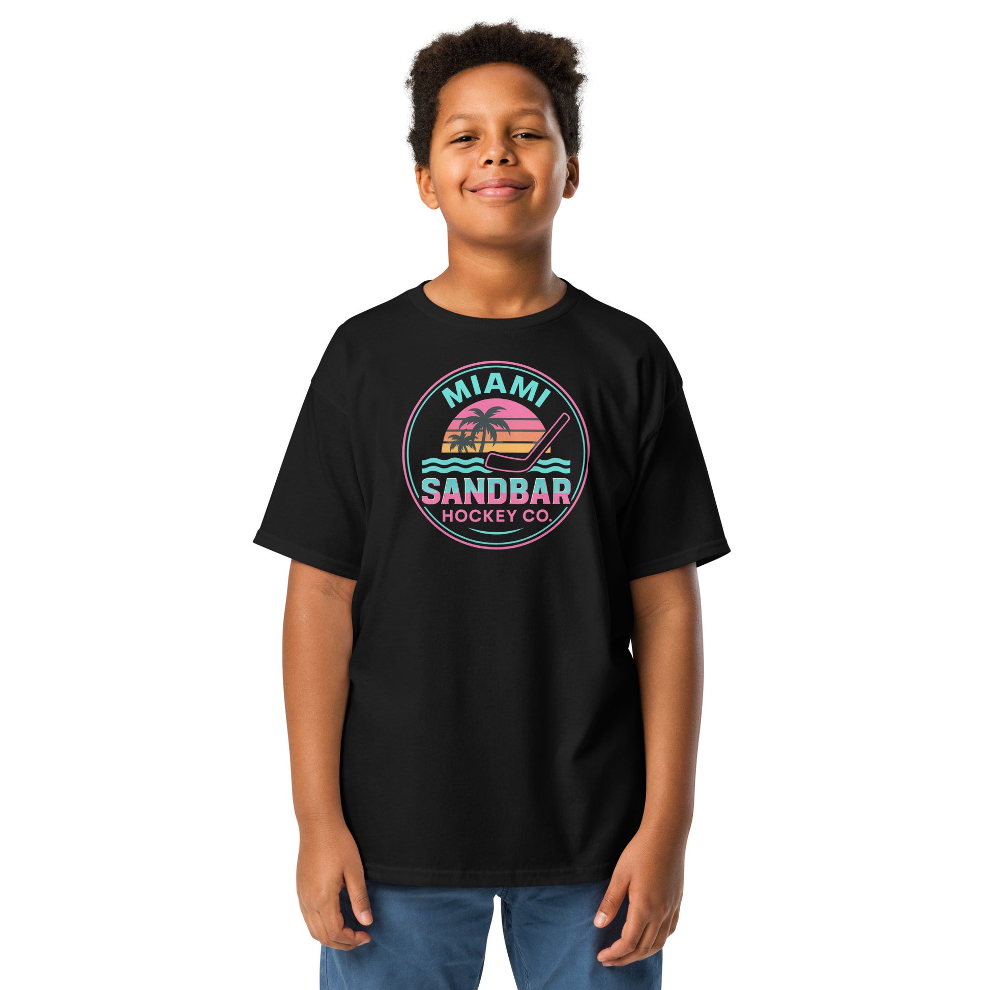 Youth black Miami Sandbar Hockey T-shirt front view with circular Miami Sandbar Hockey Co. graphic featuring palm trees, sunset stripes, ocean waves, and a hockey stick