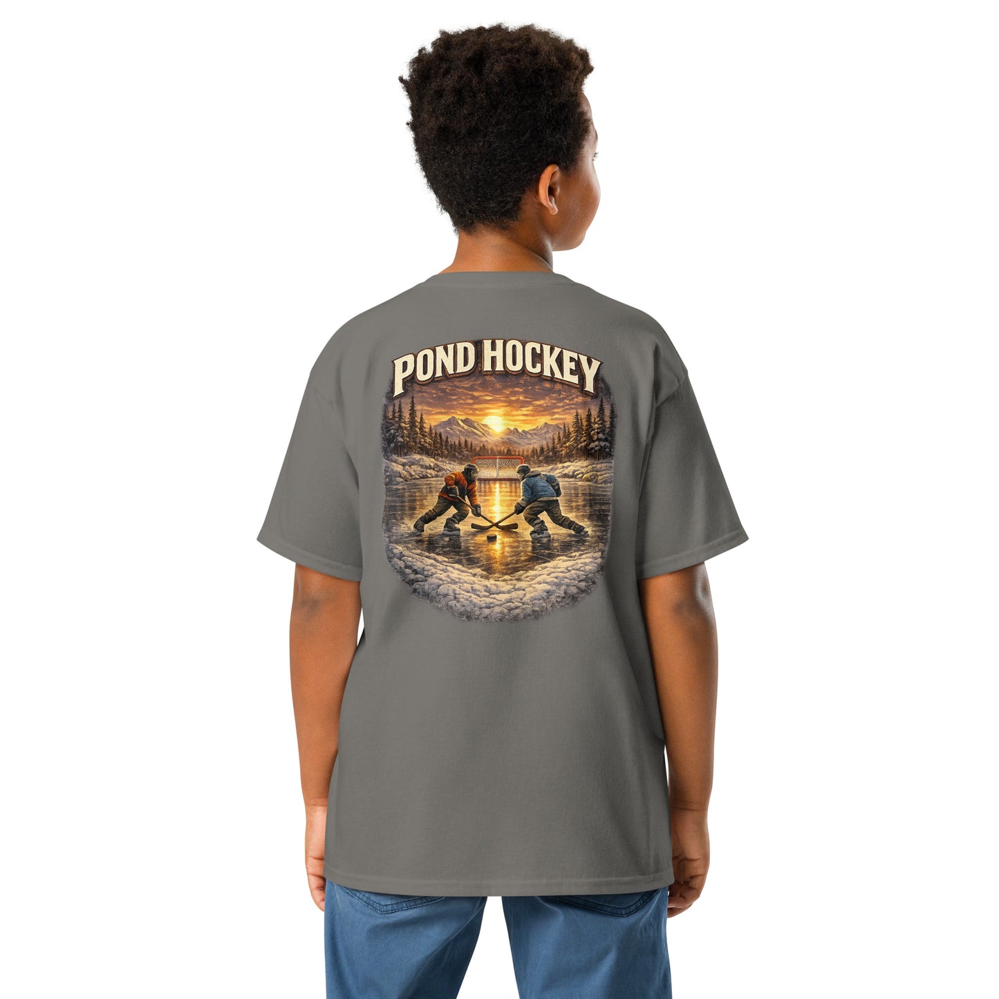 Charcoal youth T-shirt with a large back graphic showing two hockey players on a frozen pond at sunset, with mountains, pine trees, a goal net, and “POND HOCKEY” in bold lettering above.