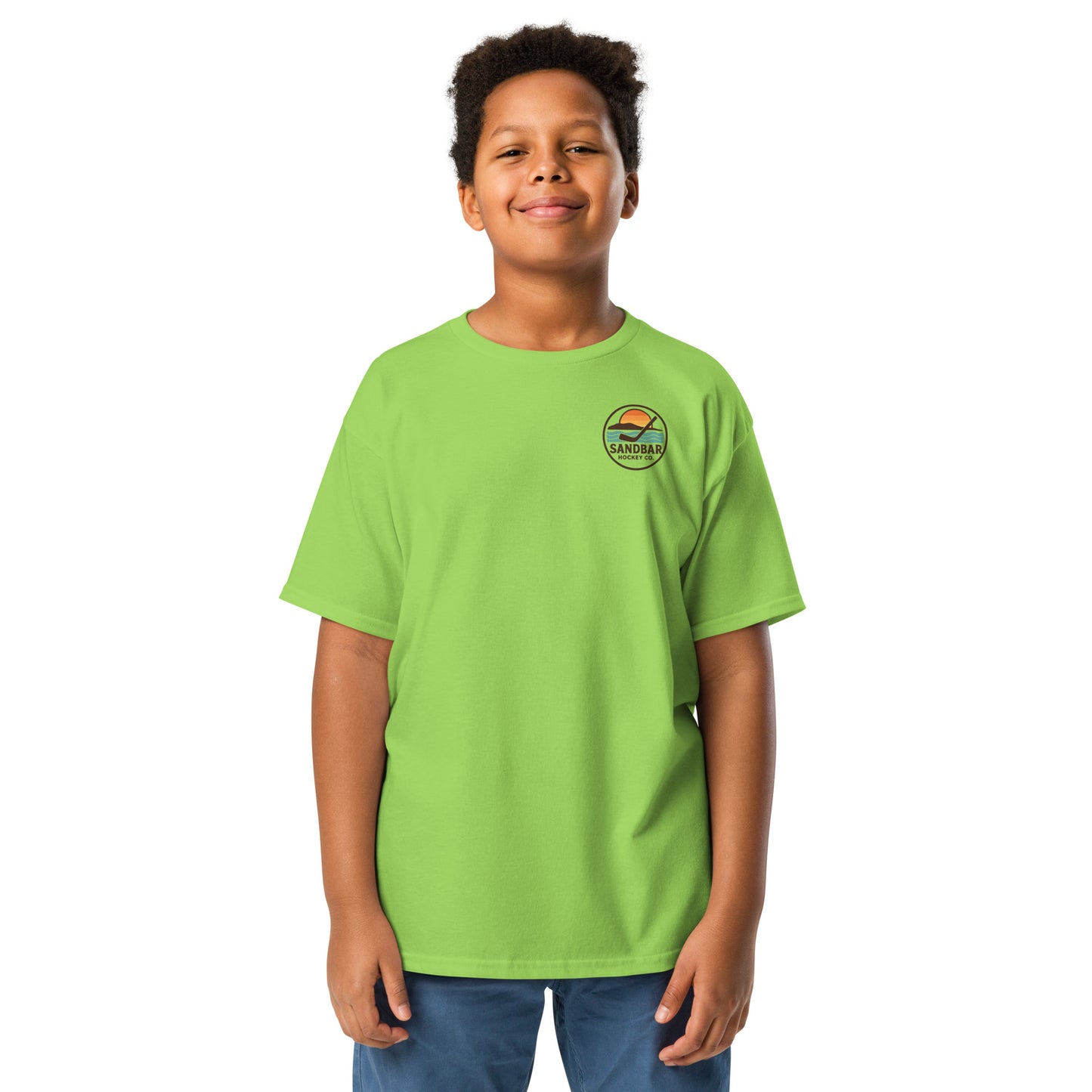 Lime green youth hockey t-shirt front side on model with small circular Sandbar Hockey Co. sunset, water, island, and hockey stick chest logo