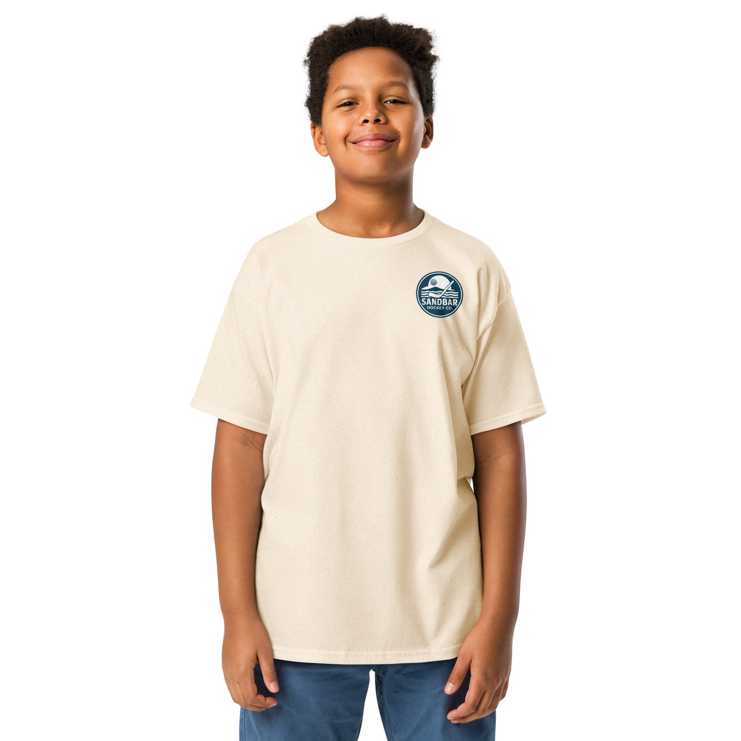 Natural Youth Fort Myers Sandbar Hockey T-shirt front view with small circular Sandbar Hockey Co. chest logo showing sunset, island, water, and a hockey stick