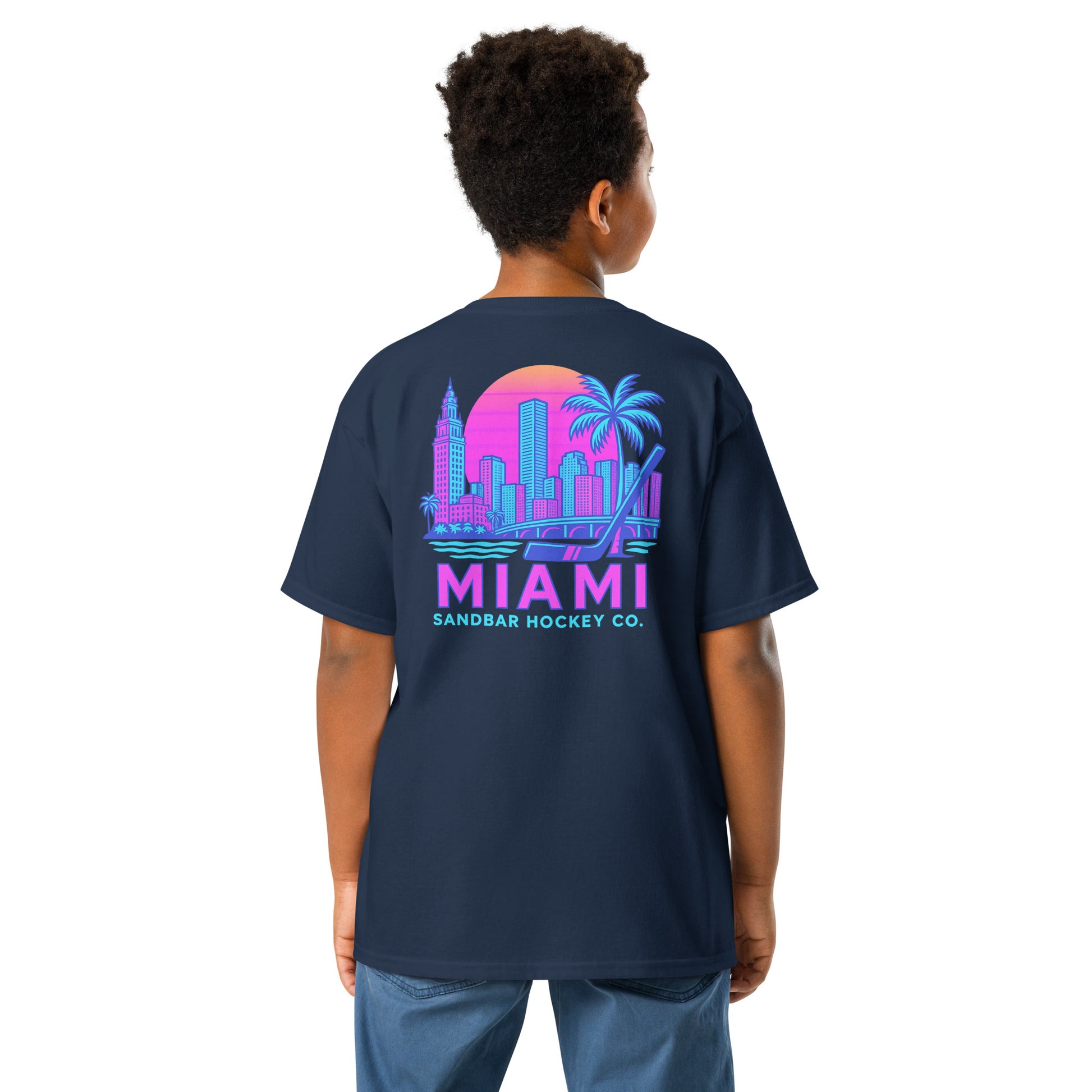 Youth black Miami Sandbar Hockey T-shirt back view worn by model with large neon Miami skyline graphic and Miami Sandbar Hockey Co. text