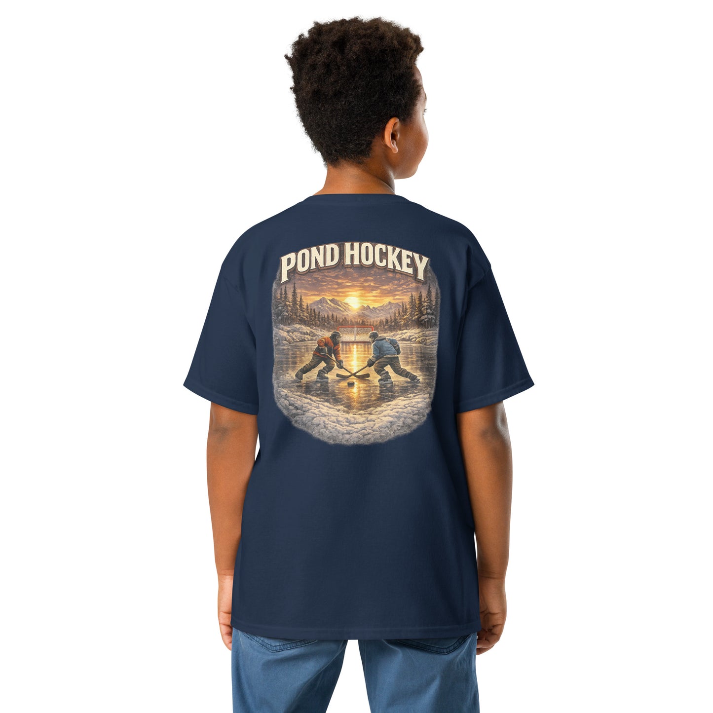 Navy blue youth T-shirt with a large back graphic showing two hockey players on a frozen pond at sunset, with mountains, pine trees, a goal net, and “POND HOCKEY” in bold lettering above.