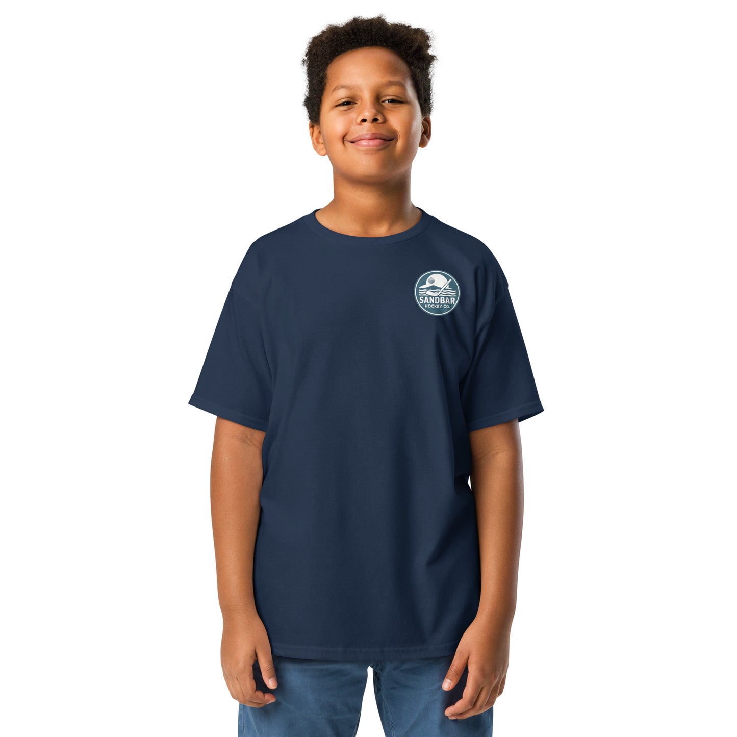 Navy Youth Fort Myers Sandbar Hockey T-shirt front view with small circular Sandbar Hockey Co. chest logo showing sunset, island, water, and a hockey stick