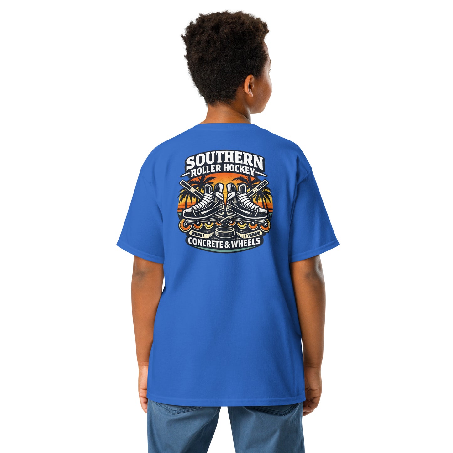 Youth royal blue southern roller hockey t-shirt back view worn by a boy, featuring the Southern Roller Hockey Concrete & Wheels graphic with inline skates, palm trees, sticks, and puck.